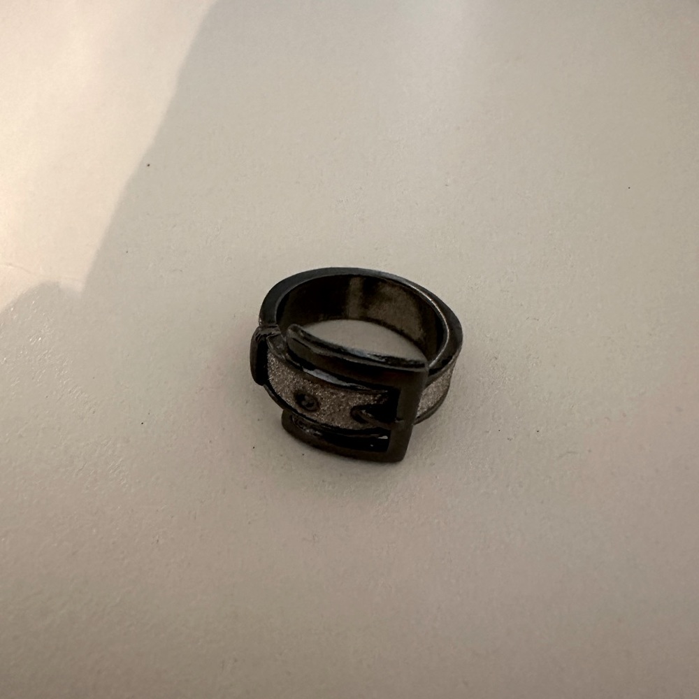Cute buckle black and shimmer ring.  Probably a size 5.